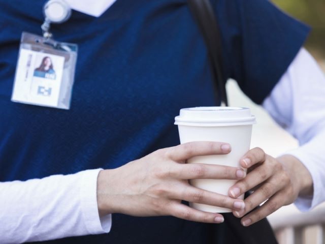 nurse holding coffee