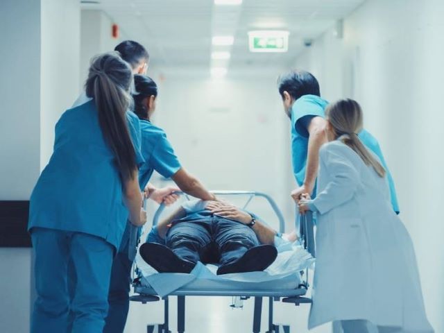 stressed nurses running through ER