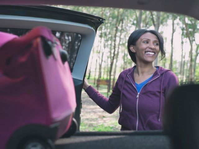 woman packing up car