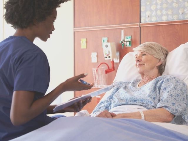 nurse talking to patient about treatment