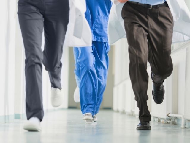 healthcare providers running to delivery room