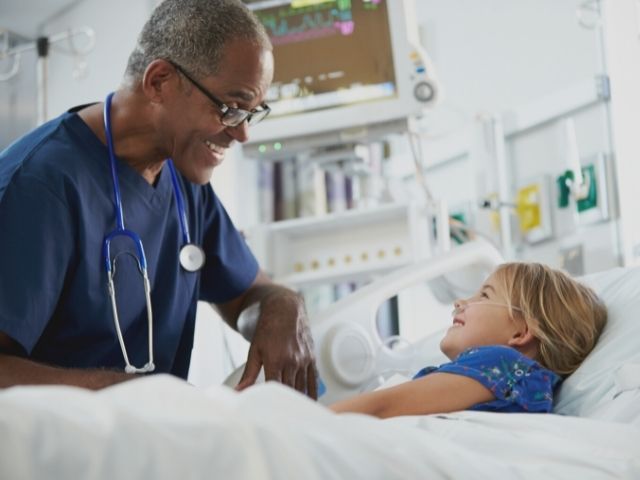 nurse with pediatric patient