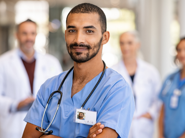 Male nurse who needs to prepare for the Minnesota Nursing License Renewal period. 