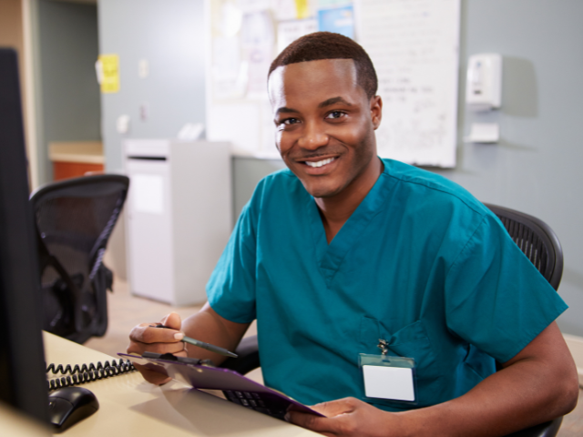 Nurse renewing LPN license on work computer