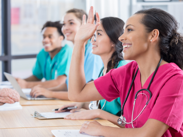 Nurses in a classroom setting, which could decrease due to Department of Education cuts.