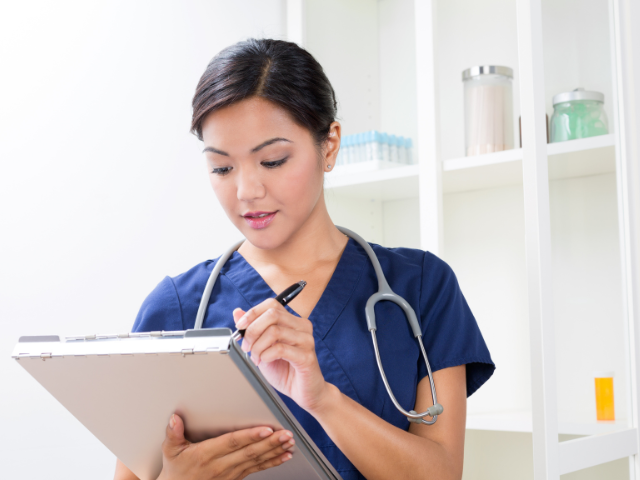 A young nurse struggling with early-tenure nurse turnover poses for a photo.