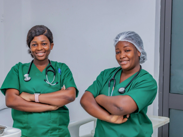 Two nurses, who might be using new nursing models, pose for a photo.